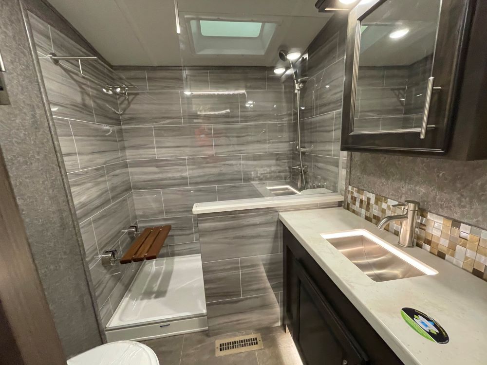 Photo of high end finishes in an RV bathroom. Camper Design Trends in 2021