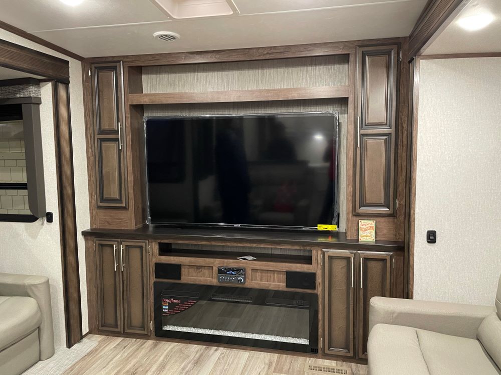 Photo of large TV in an RV. Camper Design Trends in 2021