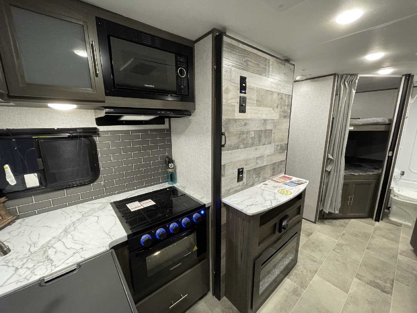 Photo of a hidden pantry in an RV. Camper Design Trends in 2021