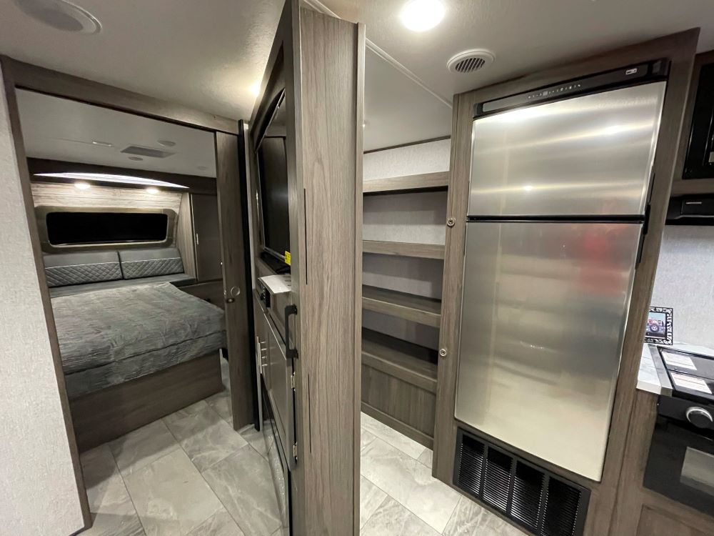 Photo of a hidden pantry in an RV. Camper Design Trends in 2021