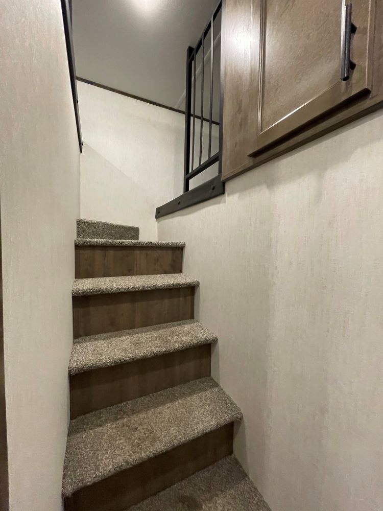 Photo of stairs to the loft in an RV. 