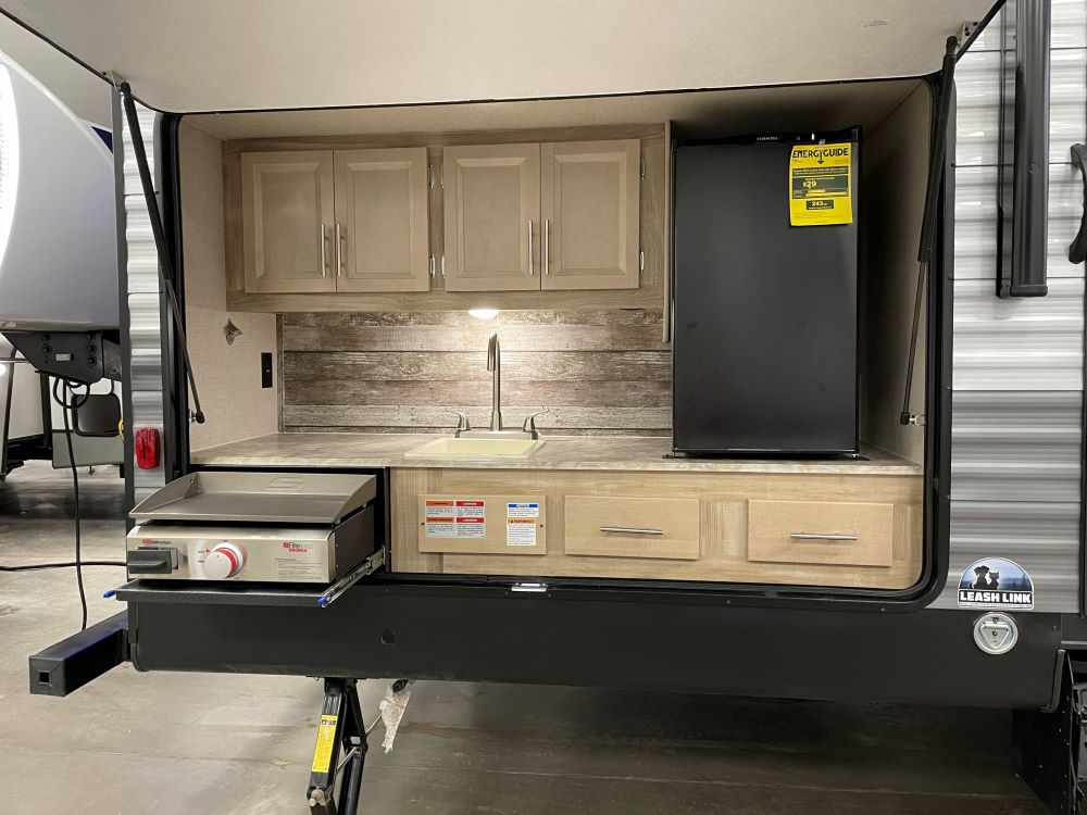 Photo of an outdoor kitchen set up in an RV. Camper Design Trends in 2021