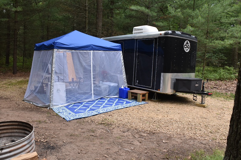 Black cargo conversion Rv trailer with screen room