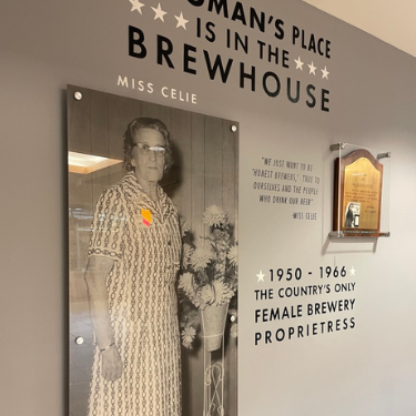 Miss Celie is shown in an old black and white photograph.  She was the only female brewery proprietress at the Shiner Brewing Company