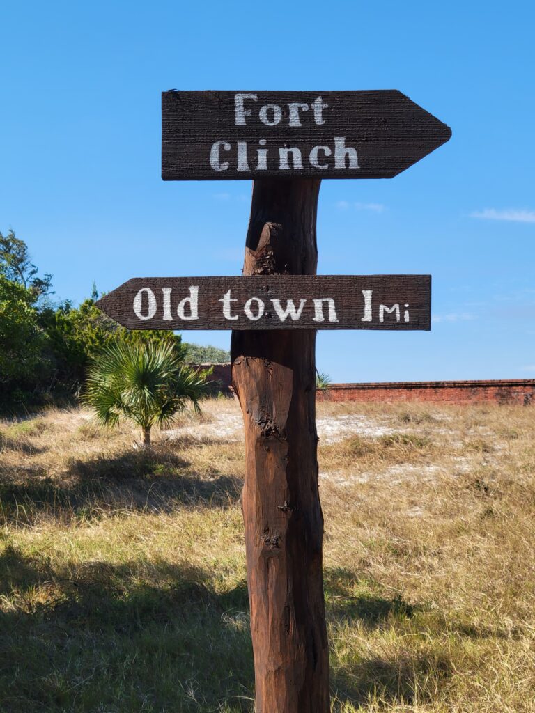 A sign showing the direction to Fort Clinch and the Old Town nearby.