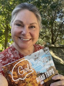 Lisa Dempsey holds a copy of the recent issue of Girl Camper Magazine. 
