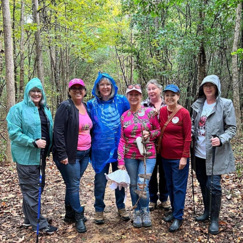 Seven ladies on a hike during a rain shower at Martin Dies Jr State Park