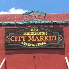 A sign reads City Market Luling, Texas