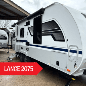 The Lance 2075 Trailer is white with black pin striping.  It shows two awnings and a pass throught storage compartment