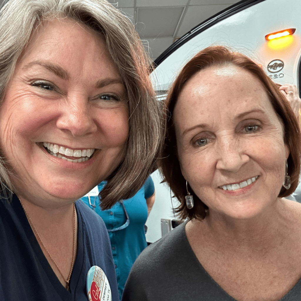 Lisa Dempsey and PJ Buerger smiling taking a selfie at the event