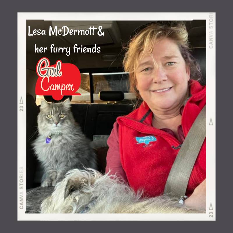 Girl Camper Lesa McDermott is in her car with her grrey long haired tabby cat and small dog.  One of the tips is to take your pets for a vet check before camping.